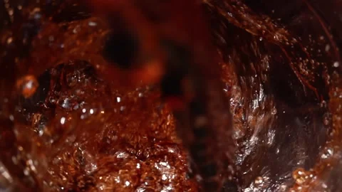 Pouring Cola Extreme Close-Up with Bubbles and Splashes Vídeos de archivo 346087981