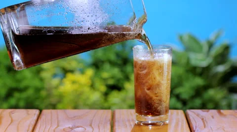 Pouring cola into a glass Stock Footage 24674727