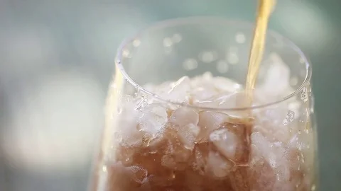 Pouring cola into a glass Stock Footage 75424399