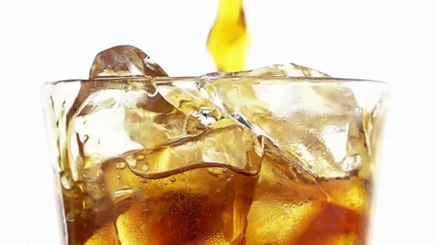 Pouring Cola into a Glass with the Ice Cubes. Видео 76728239