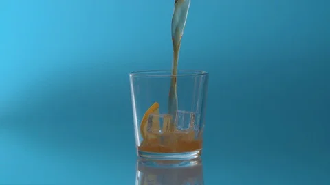 Pouring Cola with ice and bubbles Stock Footage 123999142