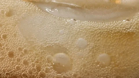 Pouring Cola with ice cubes close-up. Coke Soda closeup. 4K UHD video footage Stock Footage