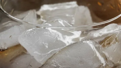 Pouring Cola with ice cubes close-up. Coke Soda closeup. 4K U Stock Footage