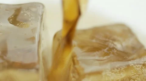 Pouring cola over ice,rotation Vídeo Stock 12844662
