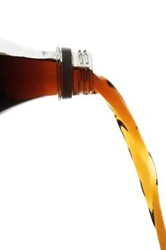 Pouring cola Stock Photos