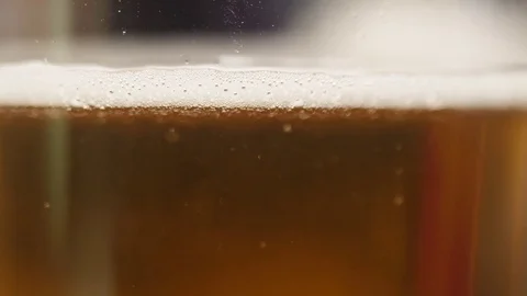 Pouring cold beer bubbles slow motion 4k Stock Footage 83992180