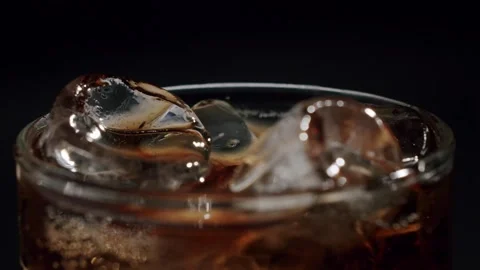 Pouring cold brew coffee into a glass with ice Stock Footage 342735730