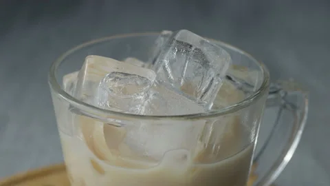 Pouring Cold Brewed Coffee over Ice. Stock Footage 170605562