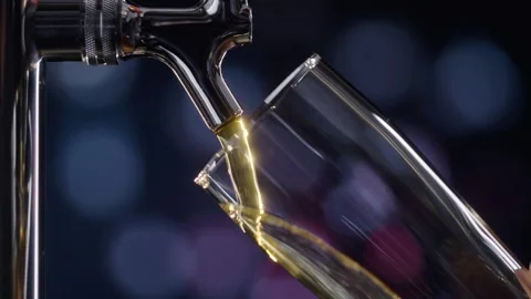 Pouring cold craft light beer with bubbles into glass  Stock Footage 257665054