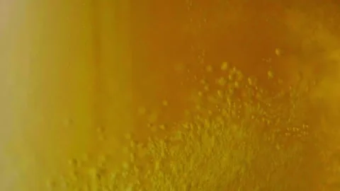 Pouring cold craft light beer with bubbles into glass  Stock Footage 257665527