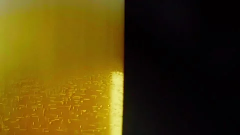 Pouring cold craft light beer with bubbles into glass  Stock Footage 257665584