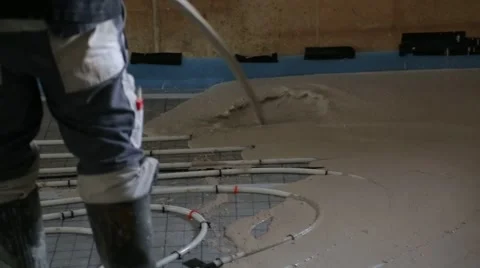 Pouring concrete on the floor with underfloor heating Stock Footage 64469751