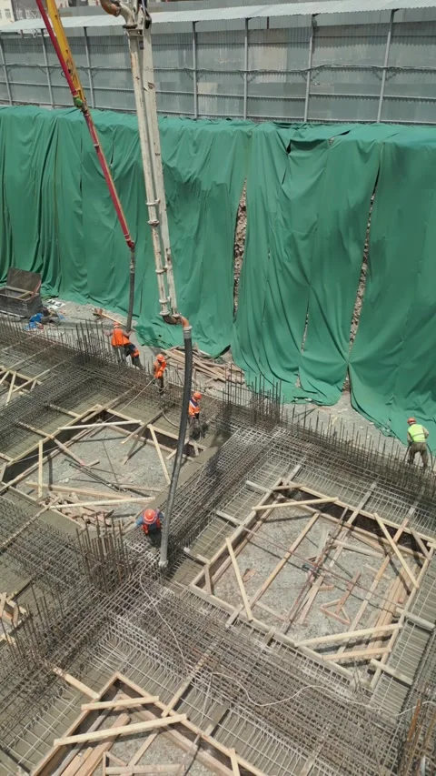 Pouring concrete floors of a building. Two concrete pump trucks Stock Footage 278397145