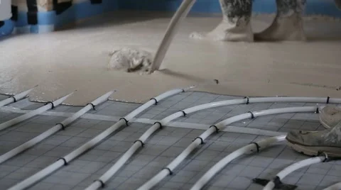 Pouring concrete on a heated floor Stock Footage 63796235