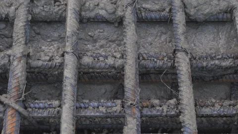 Pouring concrete into a metal structure Stock Footage 280969075