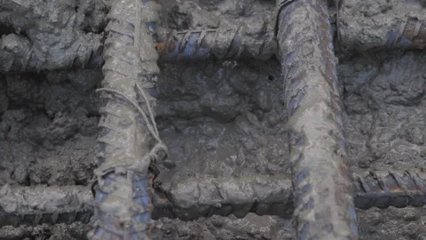 Pouring concrete into a metal structure Stock Footage 280969094