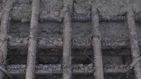 Pouring concrete into a metal structure Stock Footage 280969331