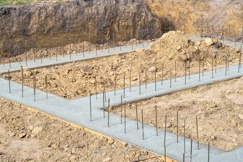 Pouring a concrete solution of the foundation of the construction of a countr Stock Photos