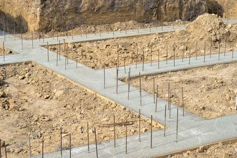 Pouring a concrete solution of the foundation of the construction of a countr Stock Photos
