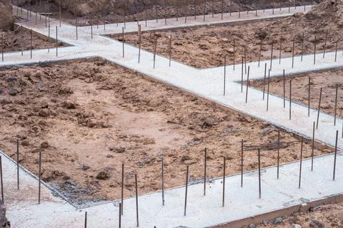 Pouring a concrete solution of the foundation of the construction of a countr Stock Photos