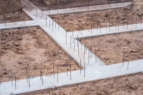 Pouring a concrete solution of the foundation of the construction of a countr Stock Photos