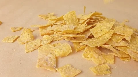 Pouring the corn flakes into a brown table Stock Footage 151027473