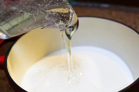 Pouring Corn Syrup into a Pot to Make Hard Candy Stock Photos
