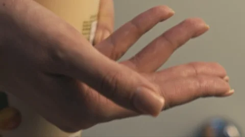 Pouring cream on hand Stock Footage 102101352