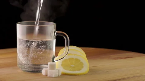 Pouring into a Cup of Hot Tea Stock Footage 50284477