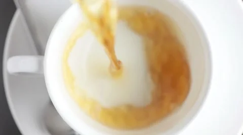 Pouring a cup of tea (from above) 스톡 동영상 8572901