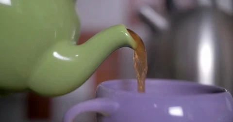 Pouring a Cup of Tea Stock Footage 84831786