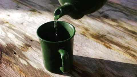 Pouring cup of tea on rustic background Stock Footage 170700043