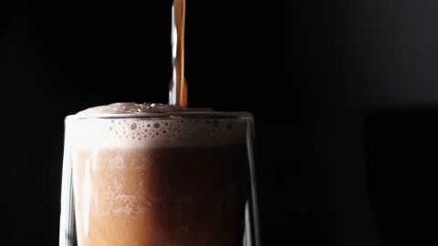 Pouring a dark beer with a thick foam Stock-Footage 164444682