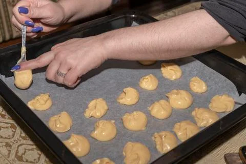 Pouring the dough into the spoon Stock Photos