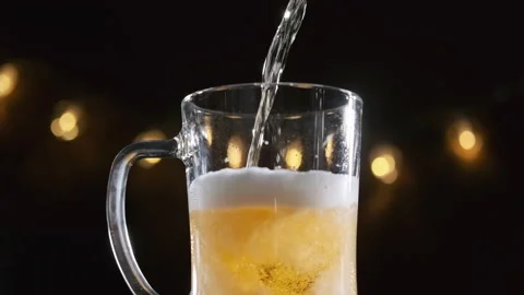 Pouring Draft Beer into a Glass at a Bar or Pub Stock Footage 168064297