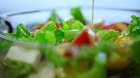Pouring Dressing Over Fresh Vegetable Salad. Stock Footage 314196956