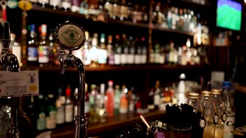 Pouring a Drink at a Busy Bar Stock Footage 287969102