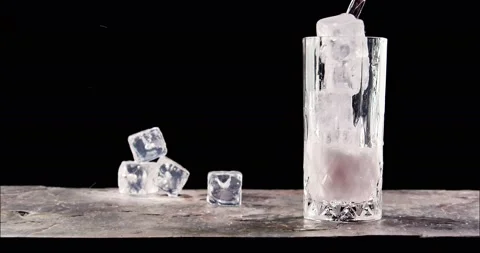 Pouring drink to glass in slow motion 库存影片 150684953