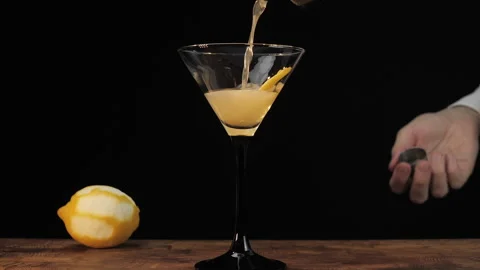 Pouring A Drink  Slow Motion - Bartender Makes Dry Martini - Nightlife Stock Footage 160058253