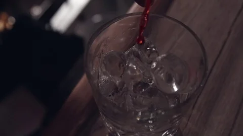 Pouring drink in slow motion Stock Footage 82585313