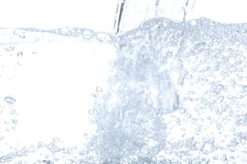 Pouring drinking water and bubble air isolated on white background with space Stock Photos