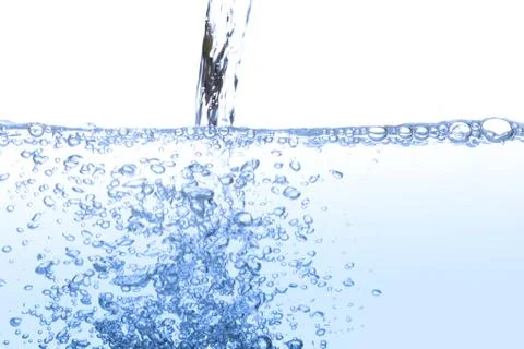 Pouring drinking water with bubble air isolated on white background. Stock Photos
