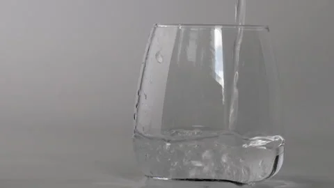 Pouring drinking water into a glass Stock Footage 252563178