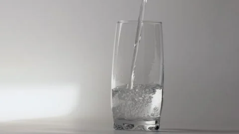 Pouring drinking water into a glass Stock Footage 252563183
