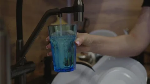 Pouring Drinking Water into Glass from Kitchen Tap Stock Footage 329889443