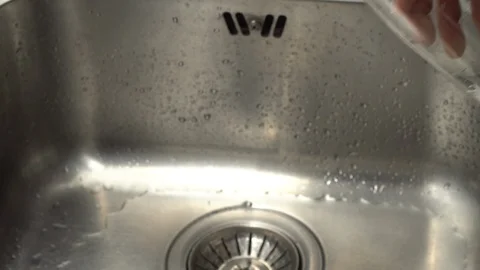 Pouring  drinking water from a kitchen tap into a glass. Stock Footage 108318958