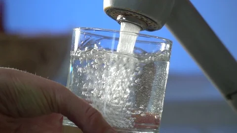 Pouring Drinking Water From A Kitchen Tap Into A Glass Stock Footage