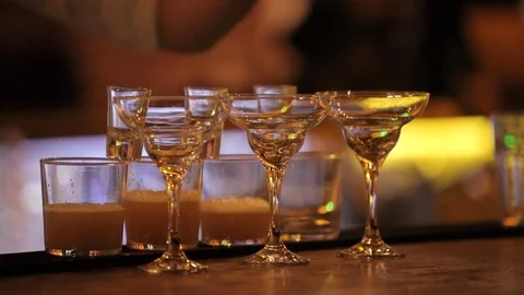 Pouring drinks into shots in a row Stock Footage 106182775