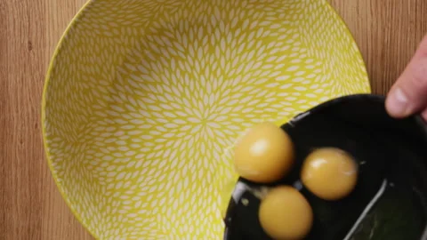 Pouring Eggs Into Bowl Top View 스톡 동영상 337249135