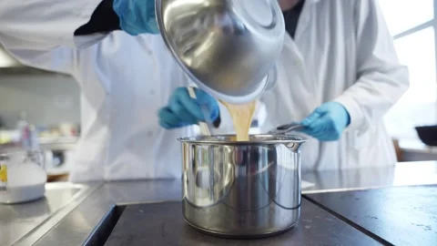 Pouring eggs into a kitchen pot Stock Footage 315505745